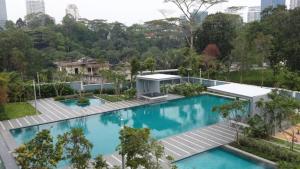 an overhead view of a large blue swimming pool at Magic suite in Kuala Lumpur
