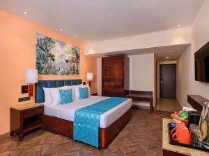 Postel nebo postele na pokoji v ubytování Daiwik Hotels Rameswaram