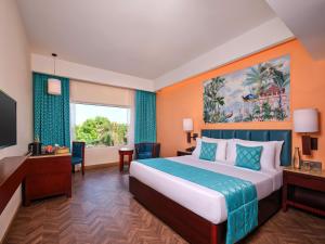 Postel nebo postele na pokoji v ubytování Daiwik Hotels Rameswaram