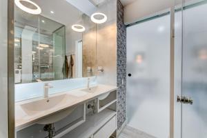 a bathroom with a sink and a mirror at BAL Apartments Adults Only in Arona