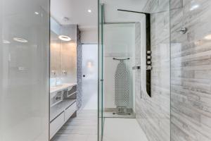 a bathroom with a shower with a glass door at BAL Apartments Adults Only in Arona
