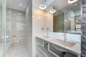 a bathroom with a sink and a mirror at BAL Apartments Adults Only in Arona
