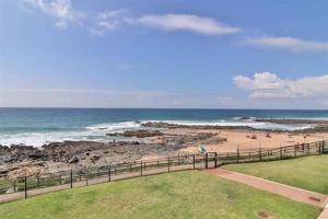 a view of a beach with people on the sand at 19 Tontiki in Ballito