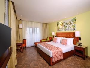 Postel nebo postele na pokoji v ubytování Daiwik Hotels Rameswaram