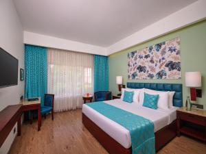 Postel nebo postele na pokoji v ubytování Daiwik Hotels Rameswaram