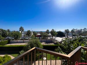 a view of the park from the balcony of a resort at Oasis a 50m del Mar in Grao de Castellón