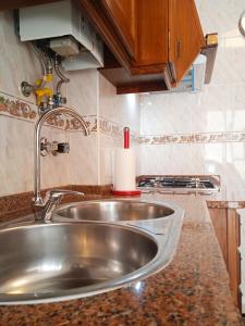a kitchen counter with a sink in a kitchen at Inviting 2-Bed Apartment in Nazare in Nazaré
