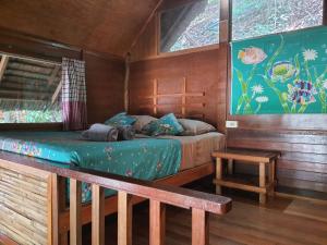 Postel nebo postele na pokoji v ubytování Sabai Corner Bungalows - SHA Extra Plus