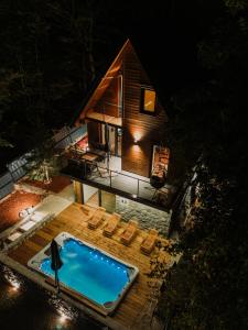 an overhead view of a tiny house with a swimming pool at The Magic Forest - Holiday Home & Spa Zone Platak in Soboli