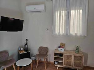 TV a/nebo společenská místnost v ubytování CASA-ORBETA
