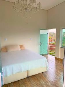 Postel nebo postele na pokoji v ubytování Rancho Kodam - Corumbá 4 - Condomínio Encanto do Lago II