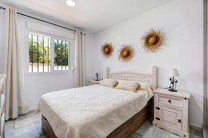 Ένα ή περισσότερα κρεβάτια σε δωμάτιο στο Apartamento Los Balcones E