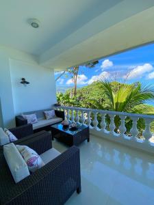 a living room with a view of the ocean at Reve Blêu in Glacis