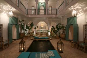 a large room with a bed in the middle at RIAD DAR DAR in Marrakesh