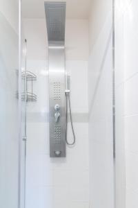 a shower in a bathroom with a shower at Studio for Couples near Beach in Gázion