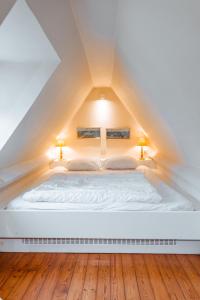 Giường trong phòng chung tại La Marjolaine