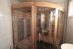 a wooden cage in a bathroom with a table in it at RIBO Apartment Katterjåkk in Riksgränsen