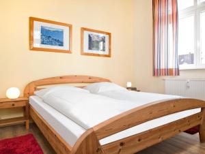 Postel nebo postele na pokoji v ubytování Ostsee Residenz Meeresblick Strandblick