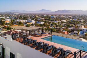 a view from the roof of a house with a swimming pool at Taylor 203 @ Morgan Residences in Cabo San Lucas