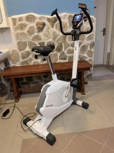 a exercise bike parked in front of a bench at Vila Jadranka in Vodice