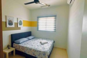 a small bedroom with a bed and a window at AF Homestay 2 Bedrooms 15mins to KLIA Free Wifi Netflix in Sepang +6 photos
