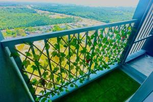 a balcony with a view of a field of trees at AF Homestay 2 Bedrooms 15mins to KLIA Free Wifi Netflix in Sepang