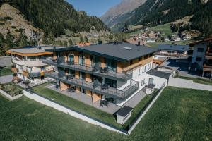 an aerial view of a house in the mountains at A CASA Granat in Sölden