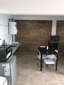 Una cocina o kitchenette en Monoambiente céntrico