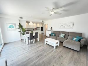 a living room with a couch and a table at PUSHE Playa Granada Beach & Golf 21 in Motril