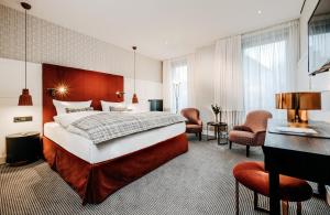 Postel nebo postele na pokoji v ubytování Hotel am Ochsentor