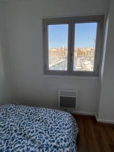 Postel nebo postele na pokoji v ubytování T4 Marseille Vue imprenable sur Vieux Port