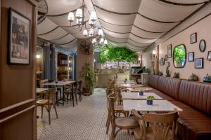 a restaurant with tables and chairs and a ceiling at Hotel Niles Istanbul in Istanbul