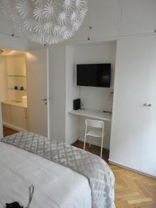 En eller flere senger på et rom på Apartamento en Recoleta