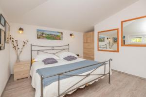 Ένα ή περισσότερα κρεβάτια σε δωμάτιο στο Villa Vita Croatica +46 φωτογραφίες