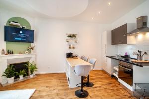 Kuchyňa alebo kuchynka v ubytovaní Appartement cosy NANCY