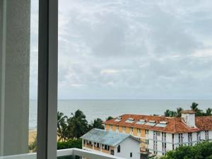 a view of the ocean from a building at Ocean Breeze by Flamingos in Negombo