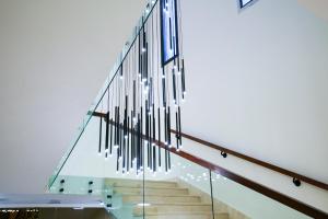 a staircase in a building with a glass wall at Vivian Park El Raeid Hotel in Riyadh