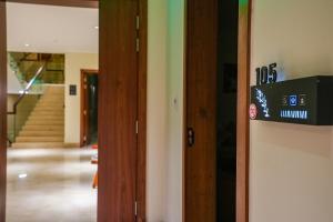 a door with a sign on it in a hallway at Vivian Park El Raeid Hotel in Riyadh