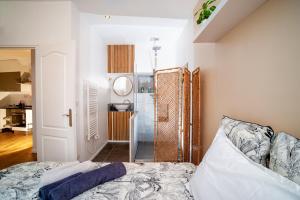 Posteľ alebo postele v izbe v ubytovaní Appartement cosy NANCY