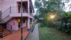 a building with a staircase on the side of it at Rincón Escondido B&B in Puerto Iguazú