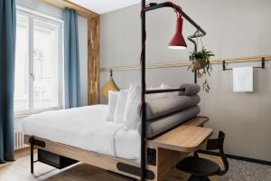 A bed or beds in a room at Stay KooooK Leipzig City - Online Check In NEW OPENING