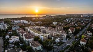 an aerial view of a city at sunset at Sopocka Rezydencja, Sun & Snow in Sopot