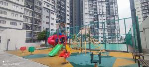 a playground in front of some tall buildings at RF Homestay Nilai in Nilai