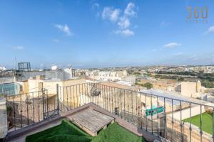 een uitzicht op de stad vanuit een gebouw bij A 3BR characteristic home in Rabat with lovely views by 360 Estates in Rabat