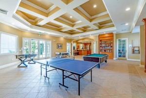 a large room with two ping pong tables in it at Theme Park Paradise! in Kissimmee
