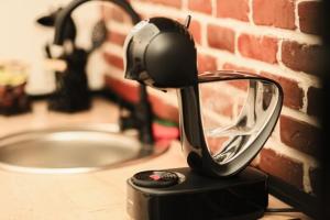 a hair dryer sitting on a counter next to a sink at Studio Zeus in Neptun