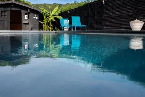 Bazén v ubytování Chez Sabine et Eric Maison pour 6 personnes avec piscine chauffée nebo v jeho okolí