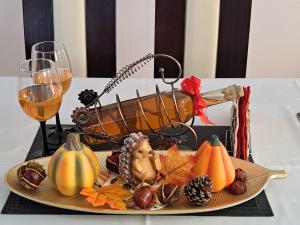 a plate of food on a table with pumpkins at Agroturystyka Gazdówka in Zakliczyn