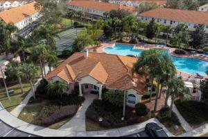 an aerial view of a house with a swimming pool at Luxurious Farm Style House in Kissimmee
