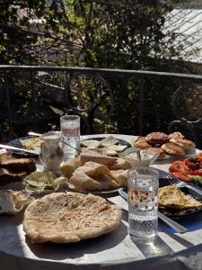 a table with a bunch of food on it at Philia's Guest House in Sighnaghi